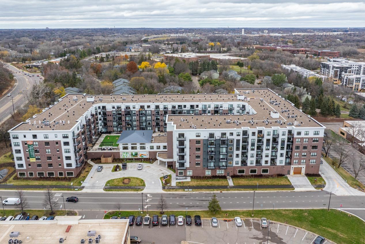 A six-story multifamily residential building seen from above.
