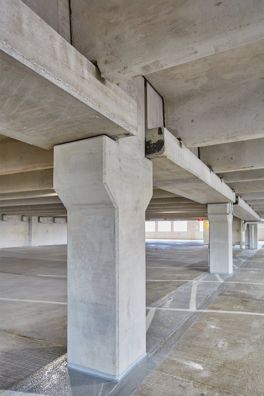  An interior view of a precast parking garage showing precast concrete columns.